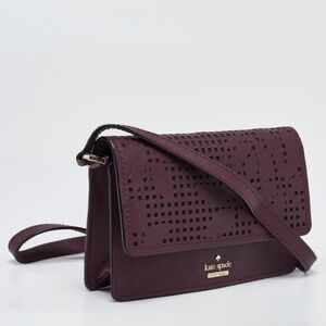 Kate Spade New York Leather Laser Cut Crossbody handbag in deep purple color